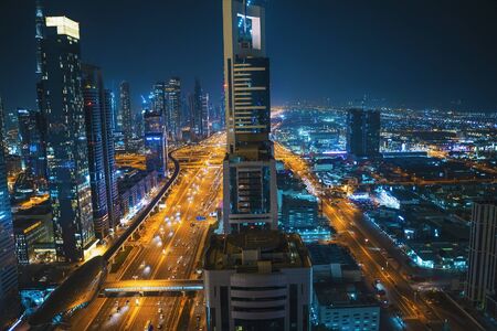 Dubai Marina, new modern district in Dubai city with skyscrapers, water canals, boats and yachts,...