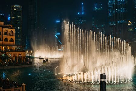 Dubai fountain with illumination at night. Popular tourist place in city downtown, UAE.の写真素材