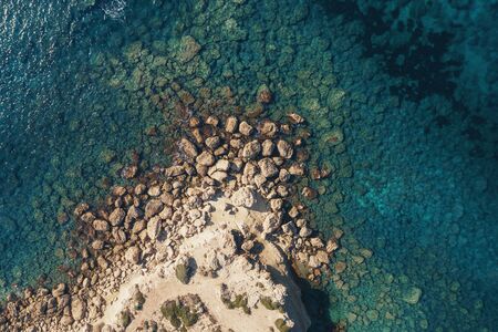 Sea aerial top view, azure water background with rocky coast in Cyprus, mediterranean landscape from above.の写真素材