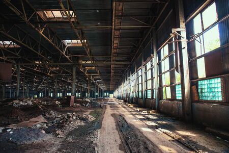 Dirty abandoned ruined industrial building inside, tonedの写真素材