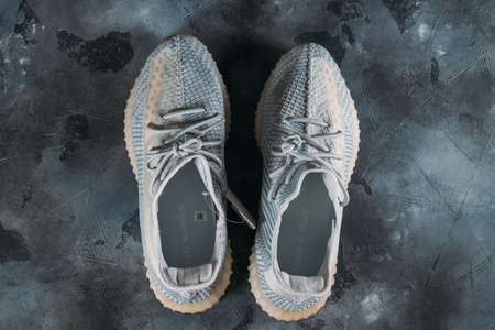 Moscow, Russia - June 2020 : Adidas Yeezy Boost 350 V2 Cloud White - Famous Limited Collection Fashion Sneakers by Kanye West and Adidas Collaboration, Trendy Sport Shoes.のeditorial素材