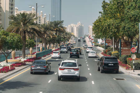 DUBAI, UAE - February 2020: Traffic on Dubai road with many cars. Dubai Marina street.