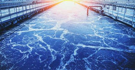 Water treatment tank with wastewater, aeration process in blue color.の写真素材