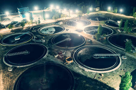 Treatment plant with tanks for purification and filtration of urban waste water, aerial view at...
