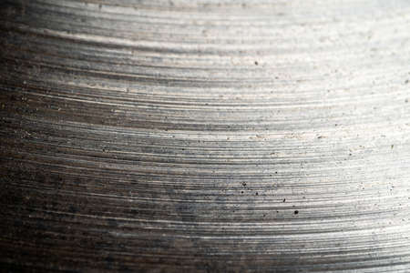 Abstract metal or scratched iron surface background. Old used car brake disc, macro photo close up.の写真素材