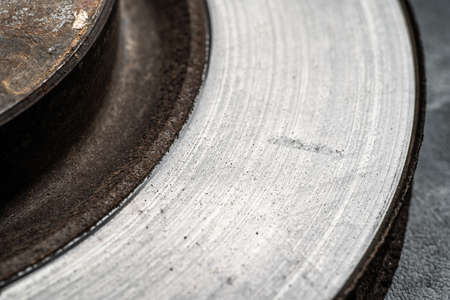 Surface of old used brake disc with scratches and grooves after intensive use, macro photography.の写真素材