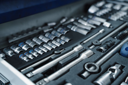 Set of tools and wrenches for car repair in garage service, close up.