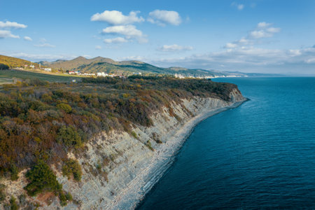Aerial view of blue sea coast and rock cliffs. Black sea, wild nature, drone flight above water.の写真素材