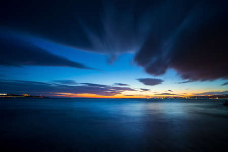 Beautiful seascape in twilight. Photo on long exposure of sea surface after sunset in evening.