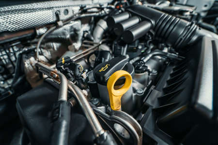 Modern turbocharged eco-friendly engine or motor under vehicle hood close up.の写真素材