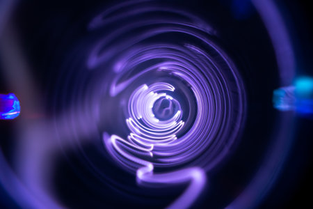 Plasma tunnel and violet electric flashes as abstract futuristic neon background.の素材 [FY310170457006]