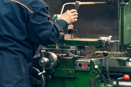 Machine tool for cutting and grinding metal products, metalwork equipment in factory, close up