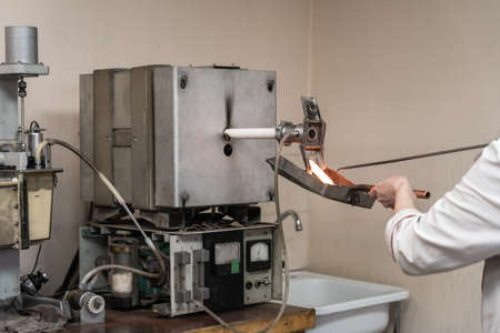Testing of burning iron of alloy sample at metallurgical plant on special laboratory equipment.の写真素材