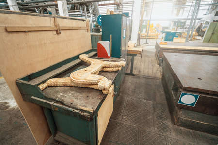 Woodwork factory with stacks of wood and equipment machinery. Professional industrial carpentry manufacturing.の写真素材