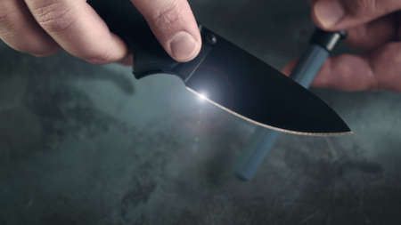 Editing pocket folding knife with Ceramic Sharp Stick or rod, knife sharpening process with tool.の写真素材