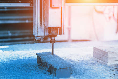 Computerized automatic lathe CNC drilling machine in factory close up.
