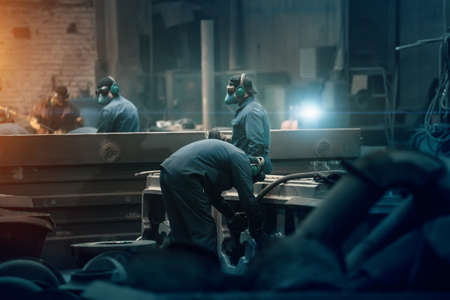 Steelworks factory workshop with workers. Industrial metallurgy manufacturing.