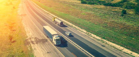 Cargo truck with container on highway aerial view. freight transportation and commercial logistic concept. copy space for text.の写真素材