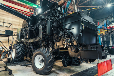Initial adjustment of agricultural tractor or combine harvester in industrial machinery factory....
