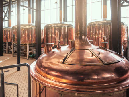 Brewery equipment. Brew manufacturing. Round cooper storage tanks for beer fermentation and maturation.の写真素材