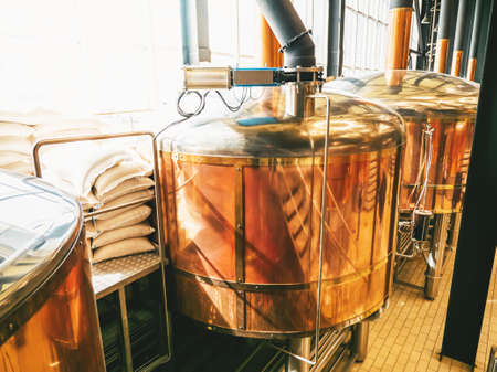 Brewery equipment. Brew manufacturing. Round cooper storage tanks for beer fermentation and maturation.の写真素材