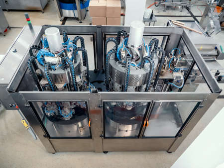 Conveyor line and filling machine in beverage production plant or factory.