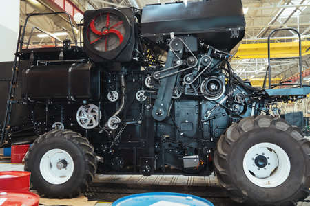 New harvester close up in process of manufacturing. Conveyor line for assembly and production of...