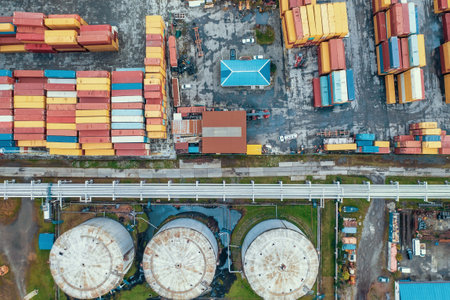 Containers in cargo freight port, aerial top view from drone. Industrial harbor, global...