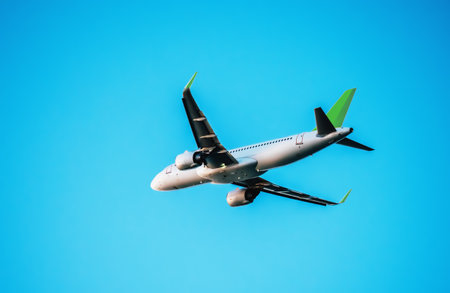 Commercial passenger airplane arrives at airport against blue sky with clouds.の写真素材