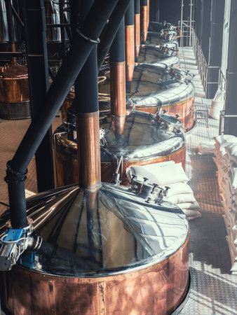 Micro Brewery and equipment. Round copper storage tanks for beer fermentation and maturation. Brew manufacturing, vertical imageの写真素材
