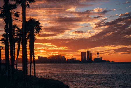 Batumi, Georgia. Panorama of resort town at sunset with silhouettes of high buildings.