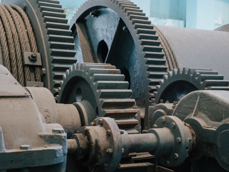 Intricate machinery details at Enguri hydroelectric plant, featuring dense arrangement of gears and mechanical parts, emphasizing industrial legacy.の写真素材