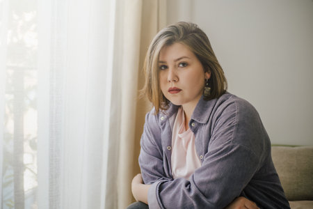 Sad Plus-Size Woman Looking at Camera.の写真素材