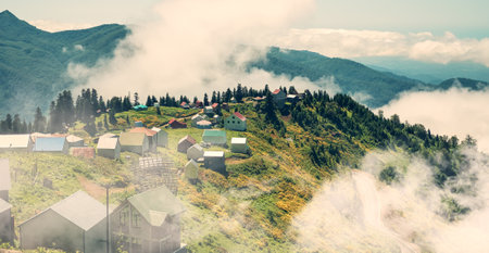 Aerial panoramic view of Gomismta village above clouds, mountainous landscapes.