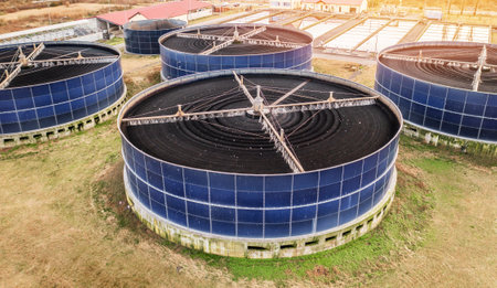 Aerial view wastewater treatment plant with large circular biofilters. Industrial sewage purification system, rotating biological contactors for sustainable water filtration environmental protection.の写真素材
