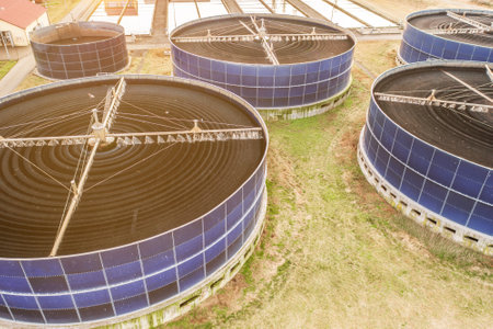 Wastewater treatment plant with circular biofilter tanks for water purification. Aerial view from drone.の写真素材