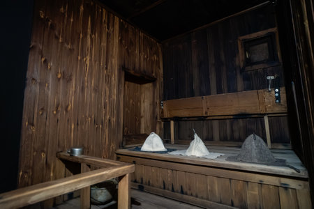 Russian Wooden Bathhouse or Sauna with stone stove and spa accessories.の写真素材