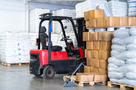 Forklift warehouse in logistics packaging pallets boxes storage distribution shipping. Supply chain...