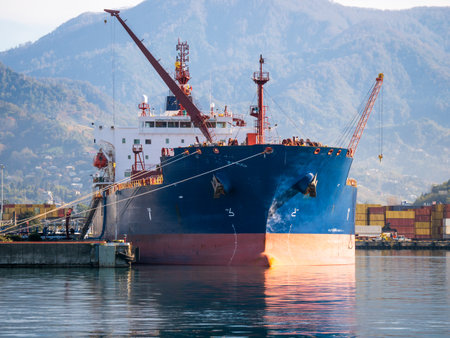 LNG tanker docked at port terminal, gas carrier vessel for energy transport, maritime logistics and fuel export industry.の写真素材