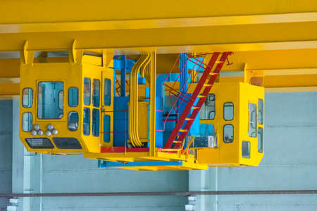 yellow cabin of industrial overhead crane at nuclear stationの写真素材