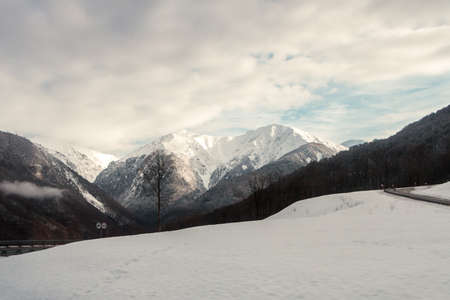 mountain peaks with snowy slopes ski resortの写真素材