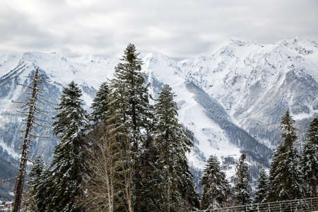 mountain peaks with snowy slopes ski resortの写真素材