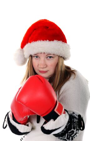 Young women in santa's hat with boxing glovesの写真素材