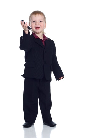 Little businessman with a phoneの写真素材