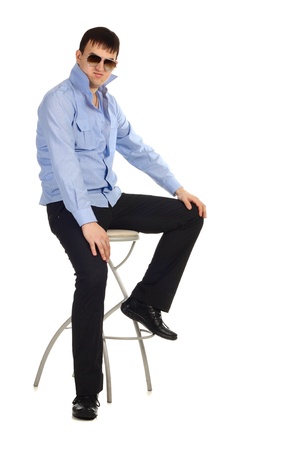 Funny guy sitting on the chair isolated on the whiteの写真素材