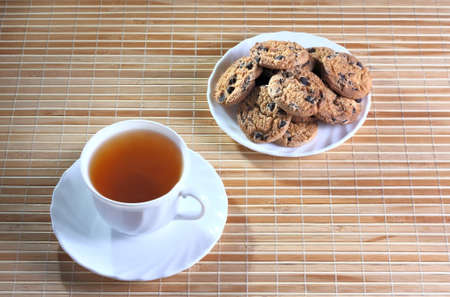 Cup of tea and cookies on the saucerの写真素材
