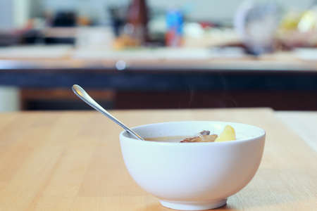 Dish with a soup on the tableの写真素材