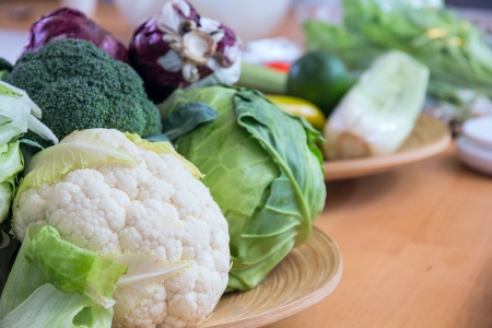 cabbage and other vegetables on the tableの写真素材