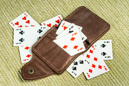 Purse made of leather and playing cards in high resolution