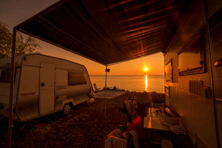 Sunrise at the lake, near caravansのeditorial素材